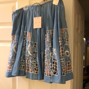 Beautiful cornflower blue skirt with peekaboo design with nude underlay